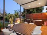 Modern garden design using grass with pool & outdoor furniture setting