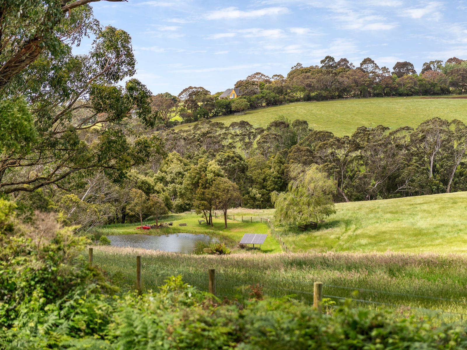 Dam and rolling green hills
