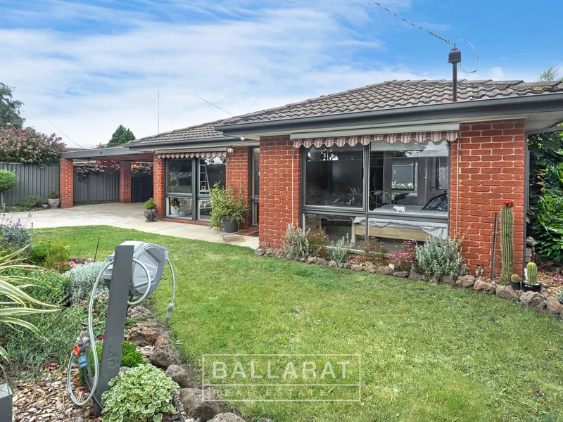 BEAUTIFULLY MAINTAINED THREE BEDROOM BRICK HOME