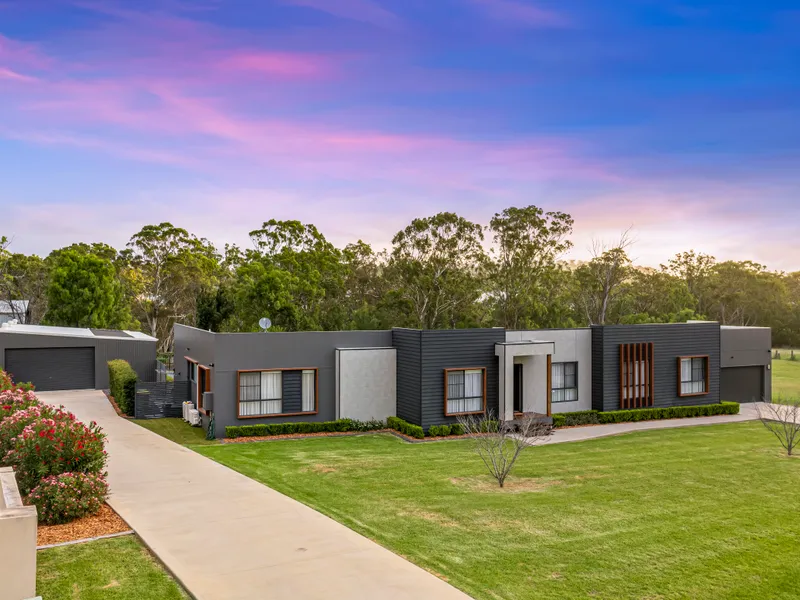 A PRESTIGE RETREAT OFFERING QUIET ACREAGE LIVING!