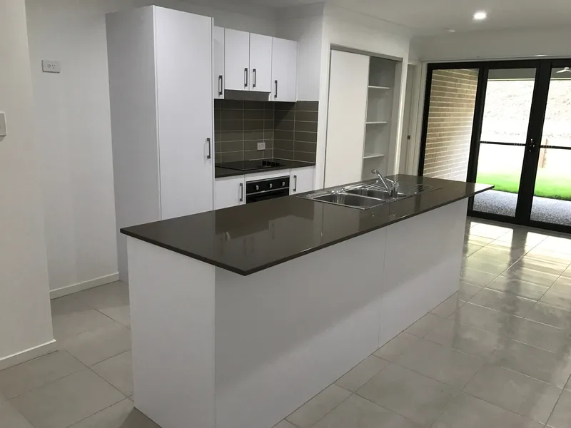 NEAR NEW DUPLEX WITH LARGE LOW MAINTENANCE YARD