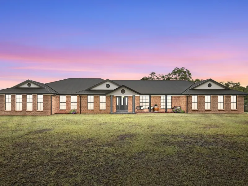 One acre of parklike ground minutes from Hunter Expressway