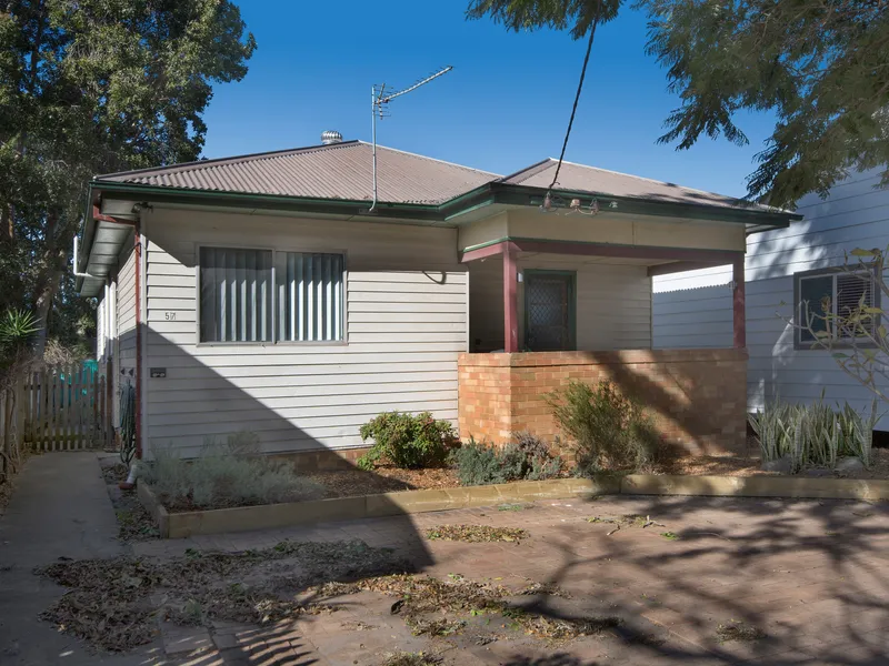 Neat and Tidy Home on Tree Lined Street