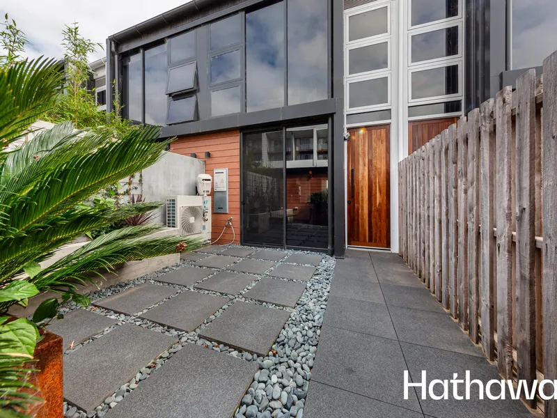 A rare offering executive two bedroom cosmopolitan styled townhouse