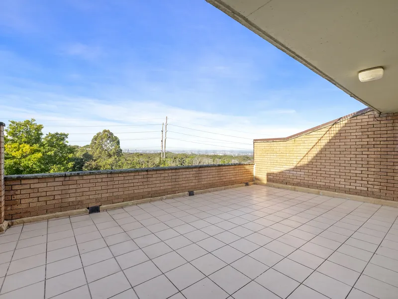 Expansive partially covered entertaining terrace with views