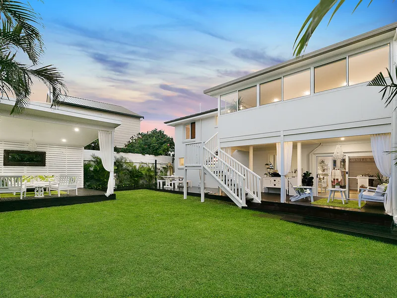 Stunning two level coastal home boasts effortless living and superb year-round entertaining