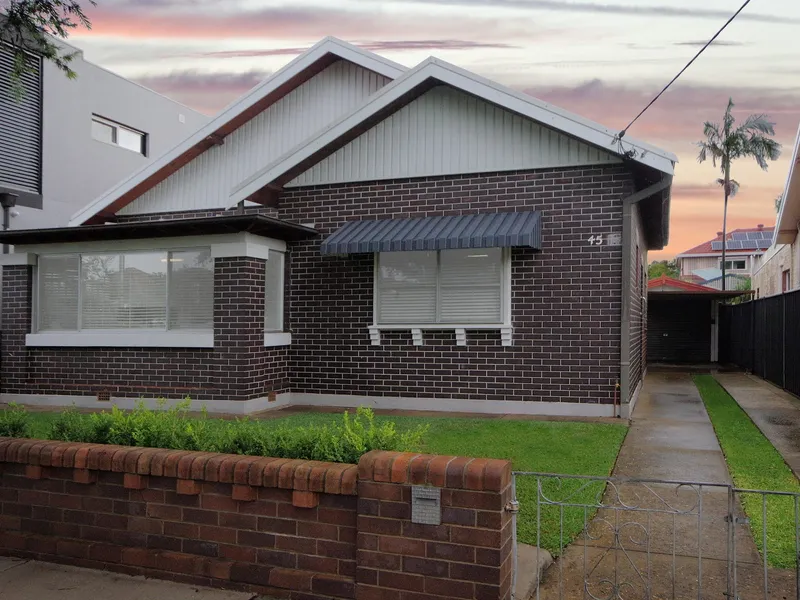 CHARACTER-FILLED FAMILY HOME WITH SUPERB STREET APPEAL