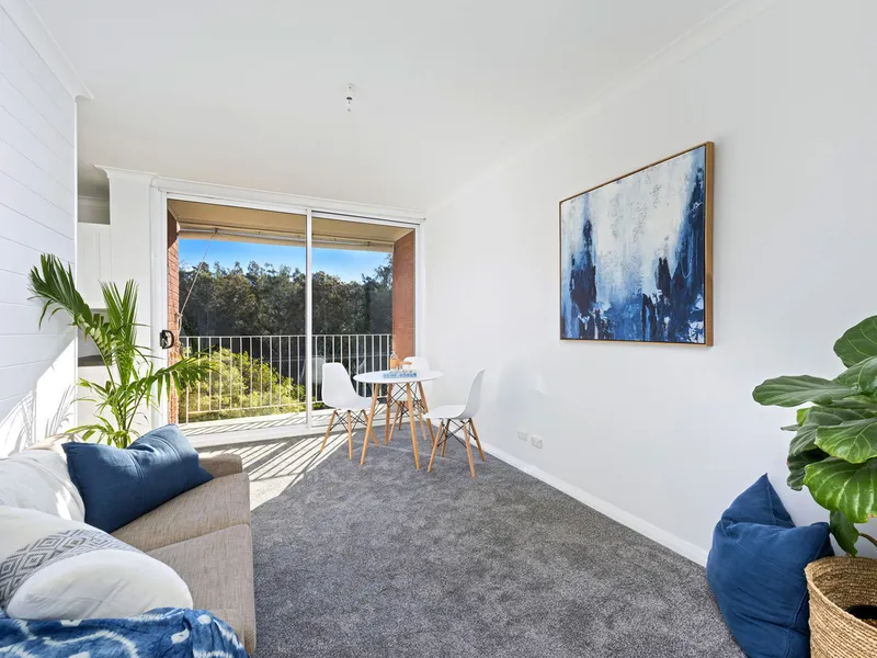 Renovated unit with balcony & lock up garage