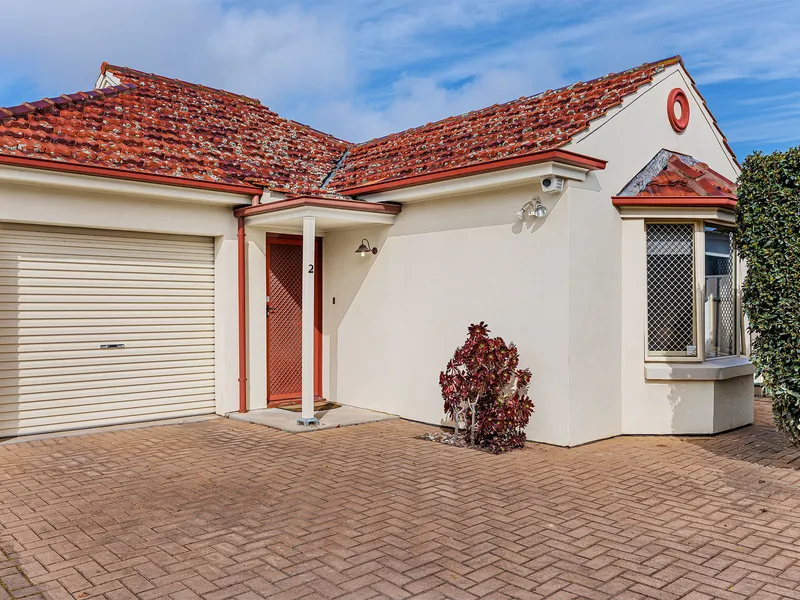 Charming courtyard home in sought after locale