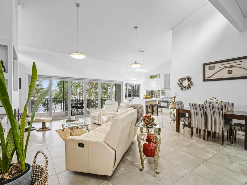 Beautifully crafted water-side home with intimate lake views