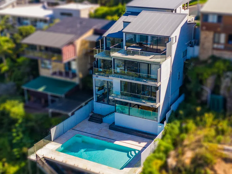 Luxury waterfront home with pool and panoramic views