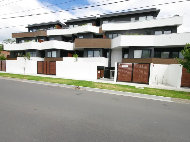 AS NEW APARTMENT WITH SHOPPING & TRANSPORT AT YOUR DOOR & IN MCKINNON SCHOOL ZONE...
