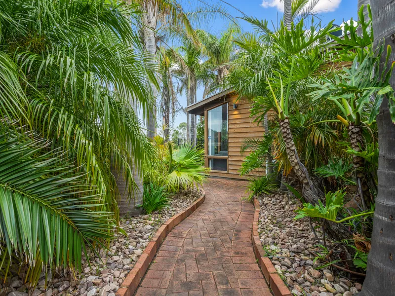 The suburban escape, minus the isolation on a special palm-studded plot…