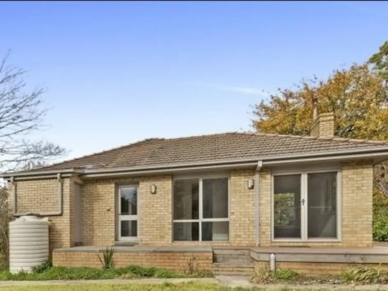 Three bedroom brick house on two titles within walking distance of Romsey CBD.