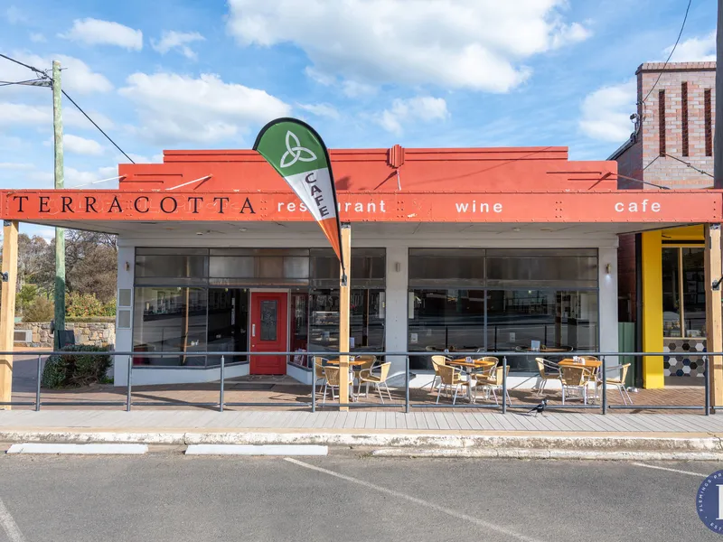 BUSINESS + PREMISES & TWO BEDROOM APARTMENT. WALK-IN/WALK-OUT.