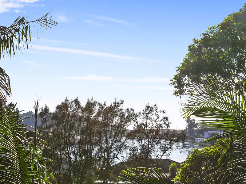 Tropical resort style home captures lagoon views