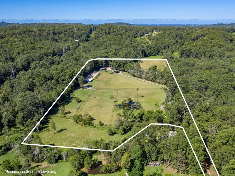 Pristine acreage oasis with substantial horse facilities