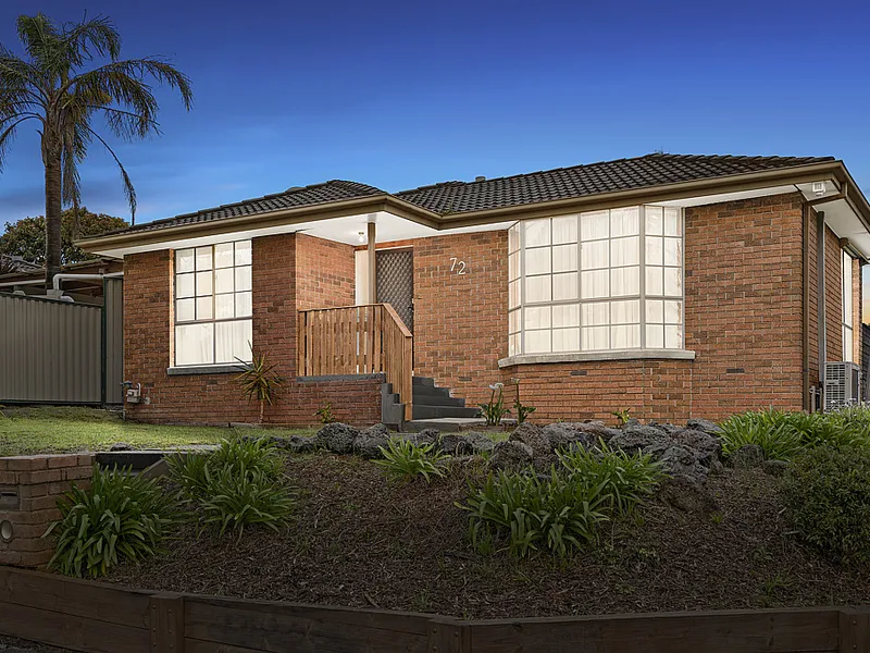 Family living with lush parkland views