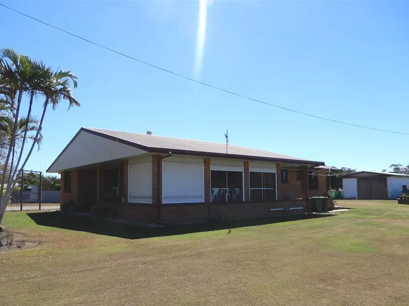 Solidly built brick family home and only 300 metres from the beach, on 3,184m2. MIdge Point Whitsundays