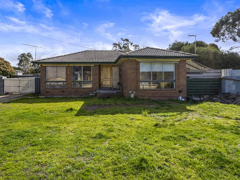 Substantial brick home on a large block – ready to renovate!