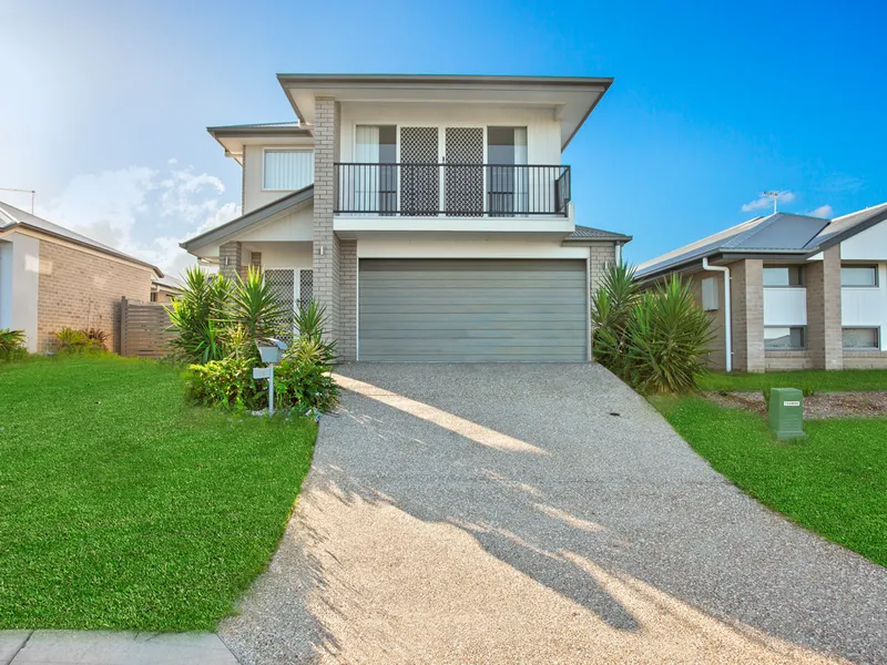Four-Bedroom Two-Story Residence with Timeless Charm