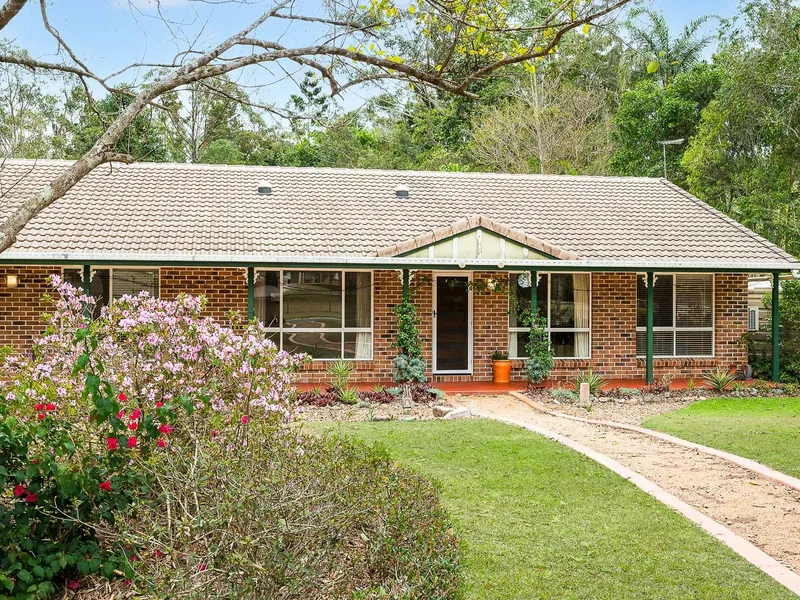 Welcoming family acreage with stunning gardens