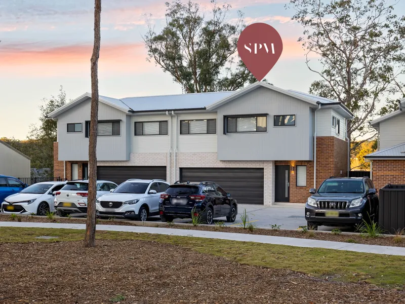 BRAND NEW spacious three-bedroom, two-bathroom townhouse overlooking reserve