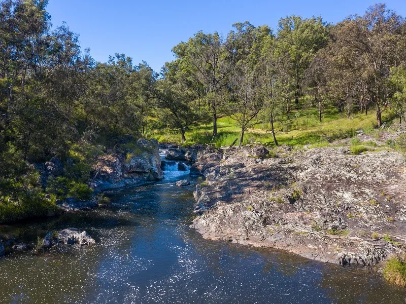Welcome to Paradise - 100 acre property on natural river frontage!