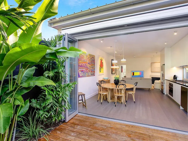 A Relaxed Beachside Haven On A Sunny North Facing Corner Block With Lush Established Tropical Gardens