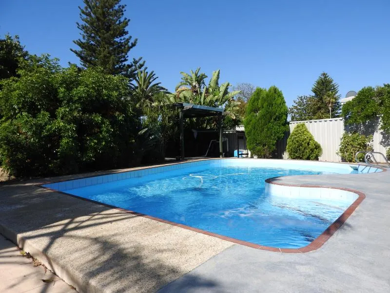 Neat 3 bedroom 1 bathroom house with split air conditioner in living room
