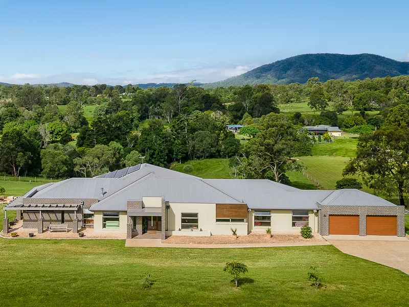 Unparalleled contemporary acreage living with large powered shed