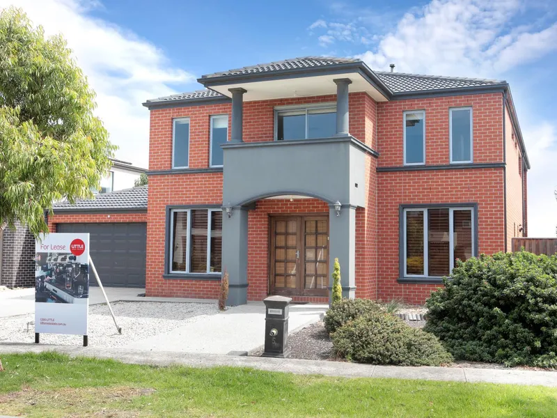 Extra Large Family home with several living zones, bulters kitchen and large rear grassed yard