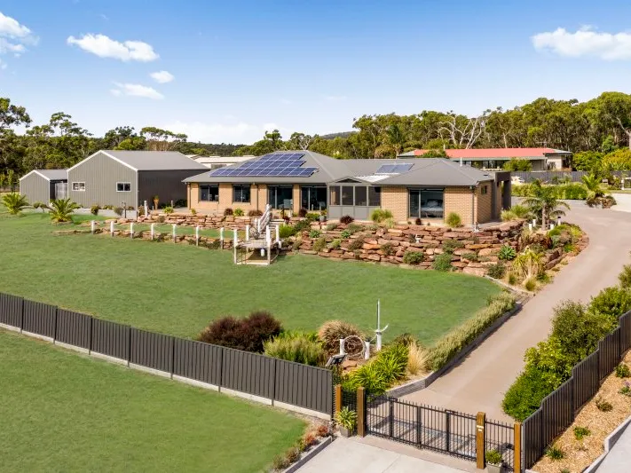 PALATIAL DESIGNER HOME WITH PANORAMIC WATER VIEWS!