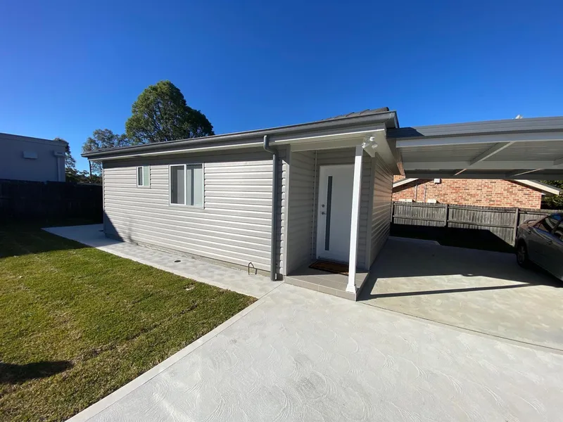 BRAND NEW 2 BEDROOM FLAT WITH A/C AND CARPORT