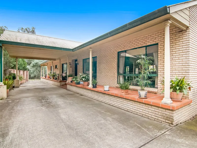 Escape to acreage with elaborate family home