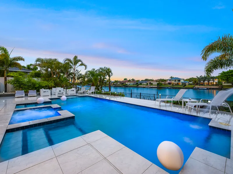 Elegant waterfront family home. Concrete & steel construction. Gated estate. The quality of a Hope Island or Sovereign Island home
