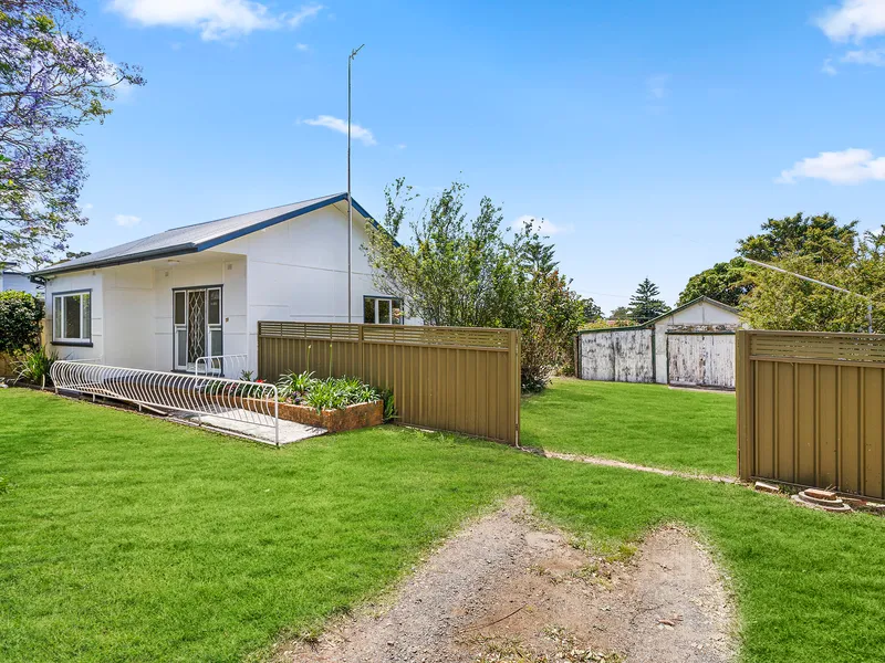 Neat cottage on a handsome quarter acre