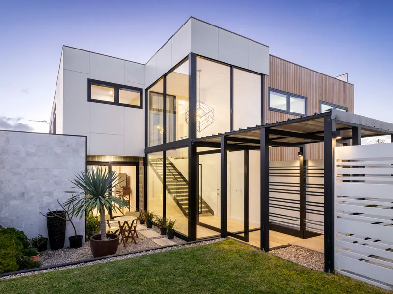 Luxury by the shoreline, rooftop entertaining with ocean view pool.