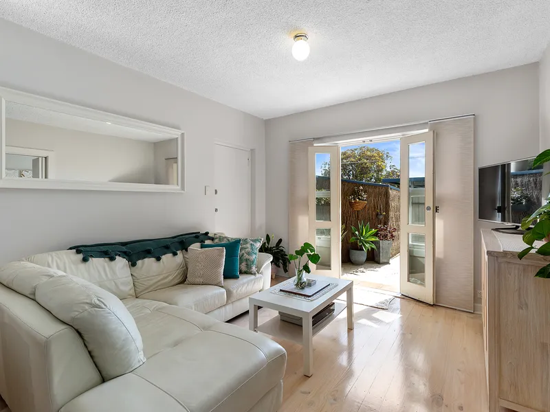 BEACHSIDE UNIT WITH LARGE PRIVATE YARD & GATED ACCESS