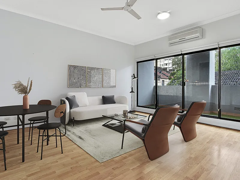 One Bedroom Apartment with Parking and A/C in Sought After Building