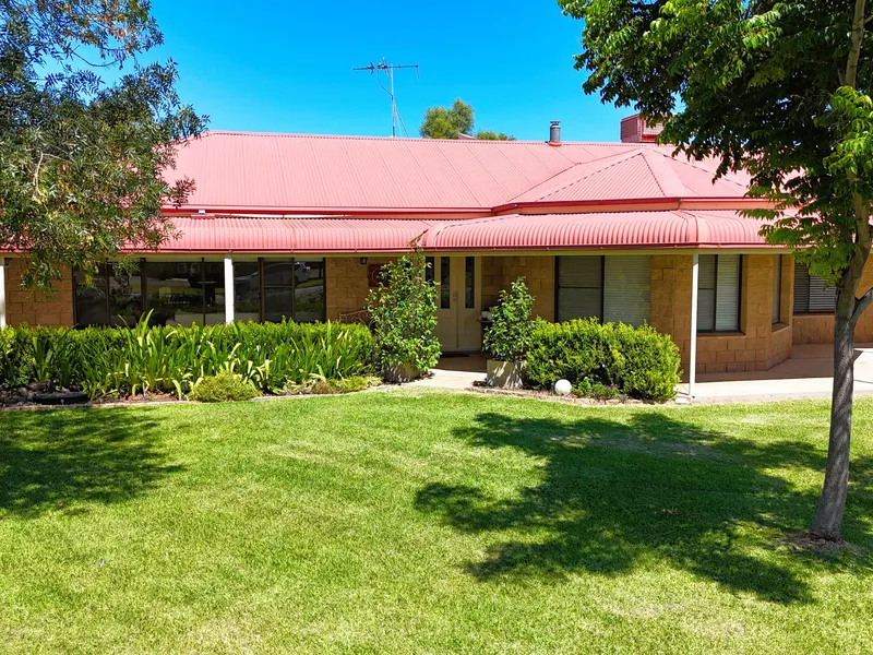 STATELY FIVE-BEDROOM HOME ON 4238 ACRES IN TOWN