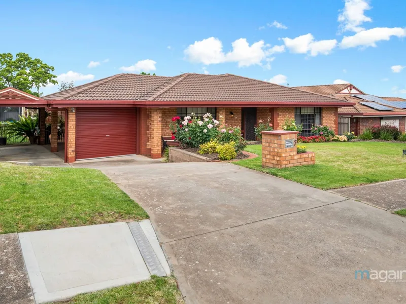 A warm & welcoming ambiance throughout, this delightful, family residence is the perfect place to call home!