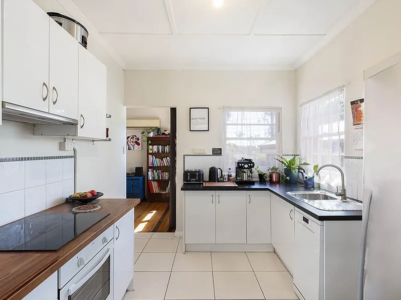 AIR-CONDITIONING... FULLY FENCED... DISHWASHER... BATH... WALK TO SHOPS...