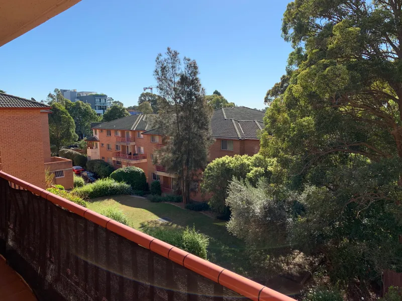 Light-filled unit in quiet position at rear of a secure complex