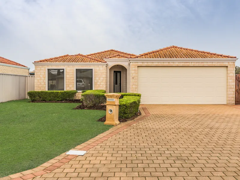 DON'T LET THE SIZE OF THE FRONT YARD DECEIVE YOU