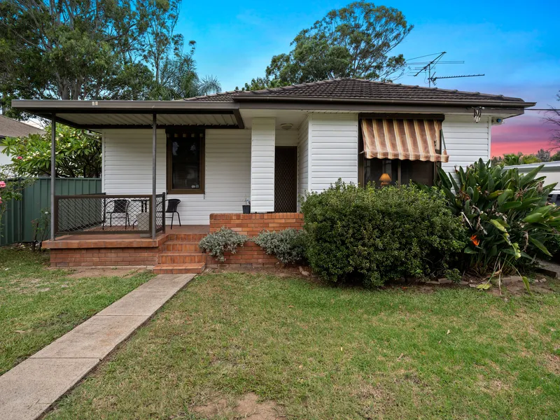 Elevated two-bedroom home enjoys a family-oriented setting
