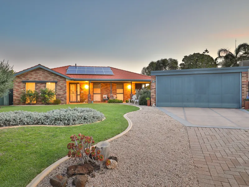 Delightful family home surrounded by manicured gardens