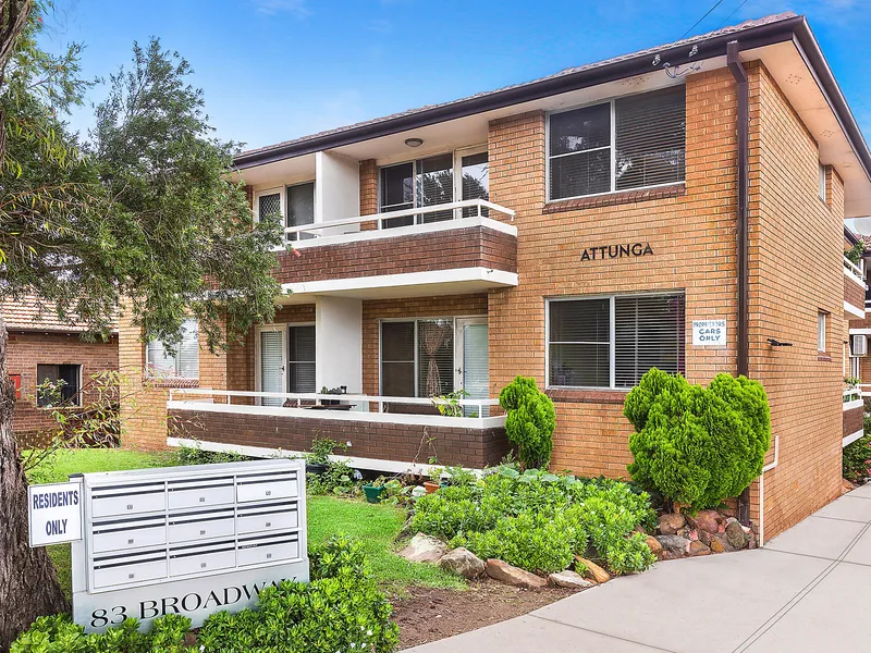 Rear facing brick apartment in desirable location