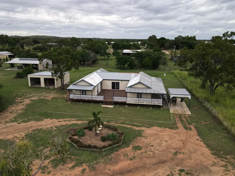 4 BEDROOM, 2 BATHROOM HOME ON 1.2 ACRES WITH TOWN WATER.