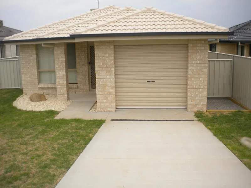 FOUR BEDROOM BRICK & TILE HOME WITH SINGLE LOCK UP GARAGE